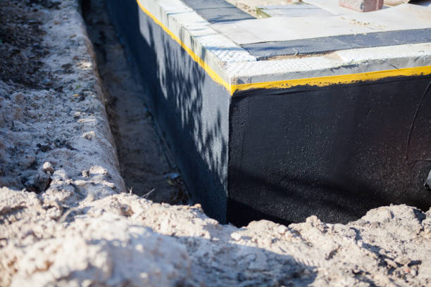 Professional Basement Waterproofing technician working in New Hampshire, OH